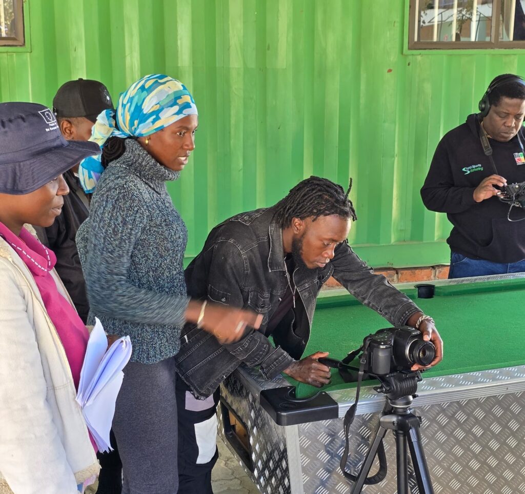 Nakai Tsuro directing Kurai Muzhona (on camera) while Austin Phiri tinkers with sound